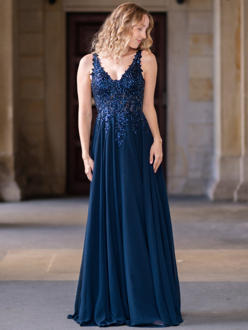 Elegantes Abendkleid in Dunkelblau mit Paillettenbesatz und V-Ausschnitt, perfekt für Ball und Gala.
